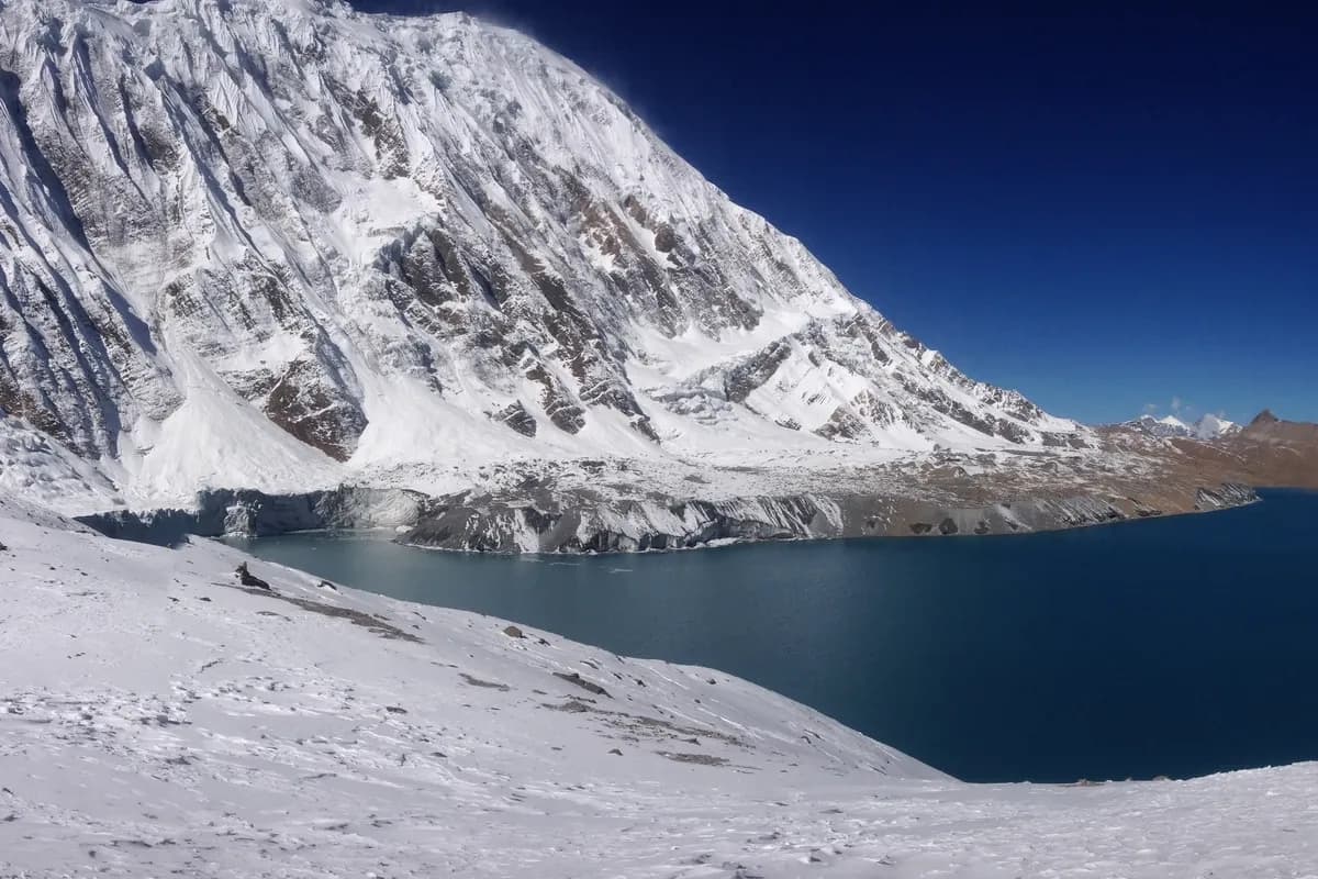 Tilicho Lake beneath snow-covered peaks in the Annapurna region of Nepal