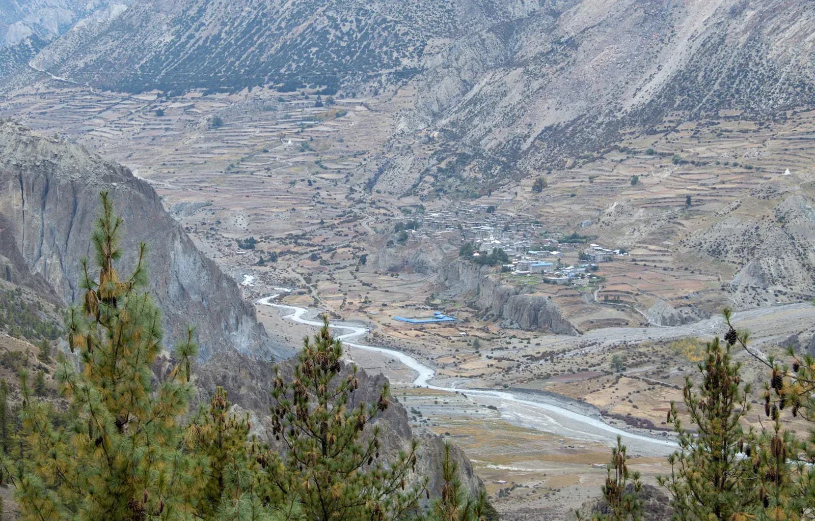 Distant view of Manang near Manang to Chame, road down on the Tilicho Lake trek in Nepal