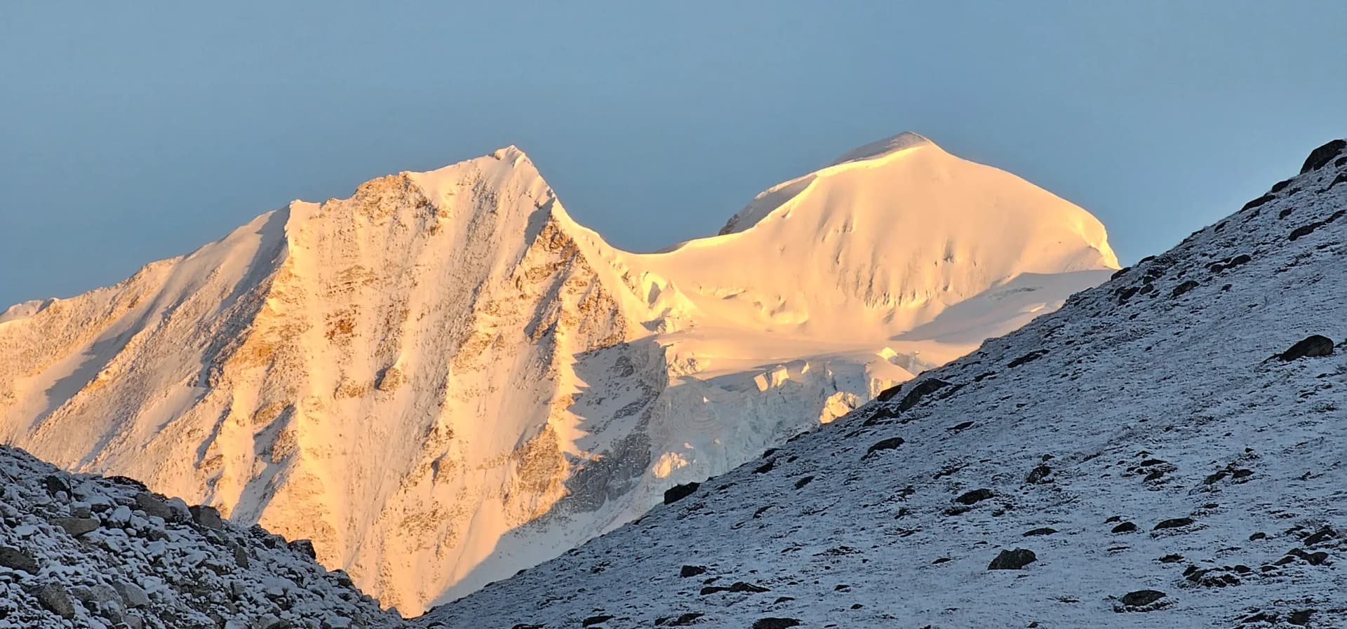 Larkya La pass crossing on the Manaslu Circuit trek with Himalayan peaks in Nepal.